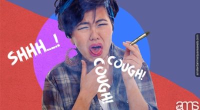 Coughing woman holding a joint